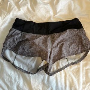 Lululemon speed up low rise 2.5 shorts, grey and black. Size 4